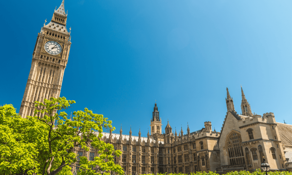 Spring Statement 2026 - image of the houses of parliament with a blue sky and some green trees