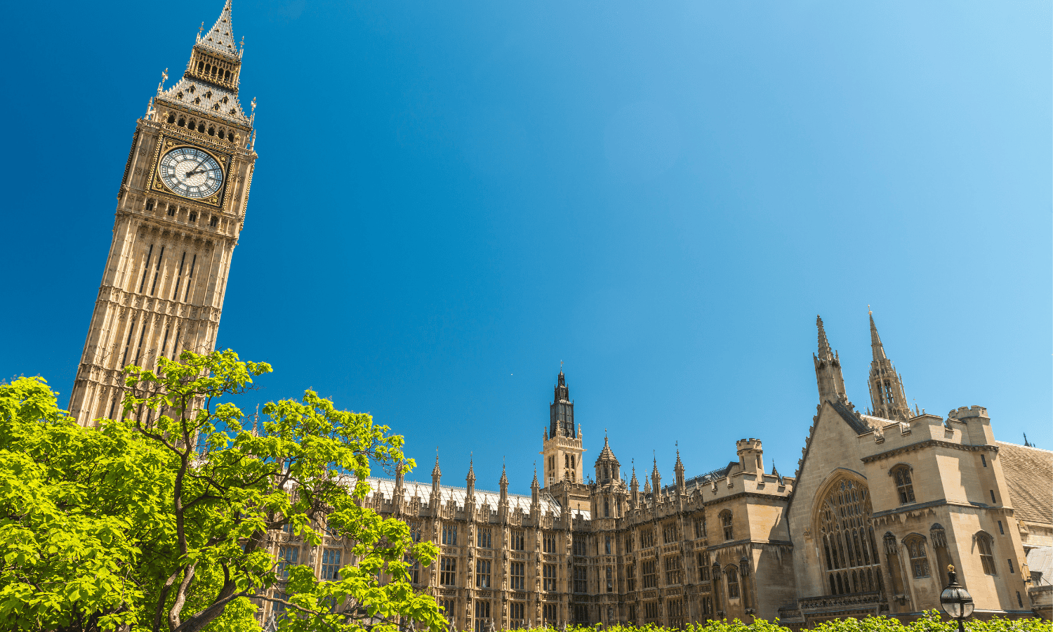 Spring Statement 2026 - image of the houses of parliament with a blue sky and some green trees